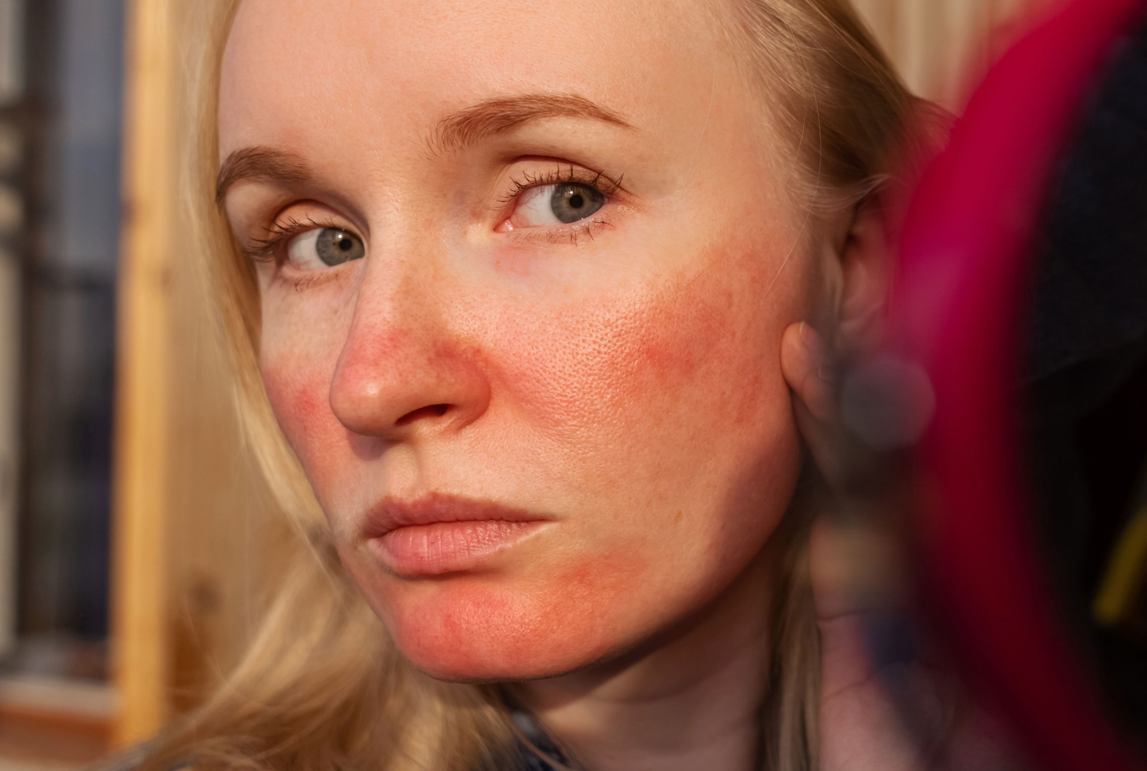 Blonde woman with red skin